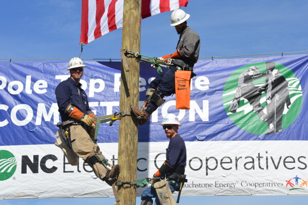Story, left, bring home top honors in Pole Top Rescue competition