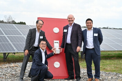 Ceremoniously flipping the switch: Brighter Future Solar facility: