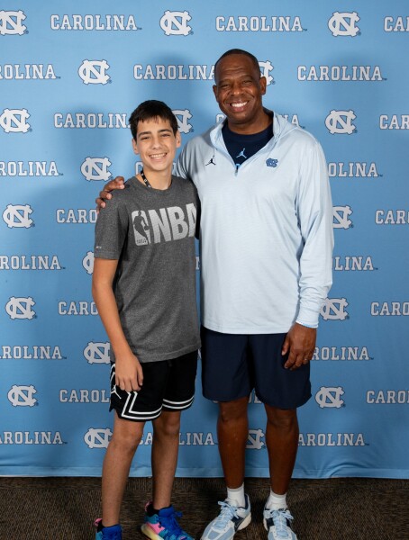 Liam Parsons is pictured with the UNC Chapel Hill Men’s Basketball Coach, Hubert Davis